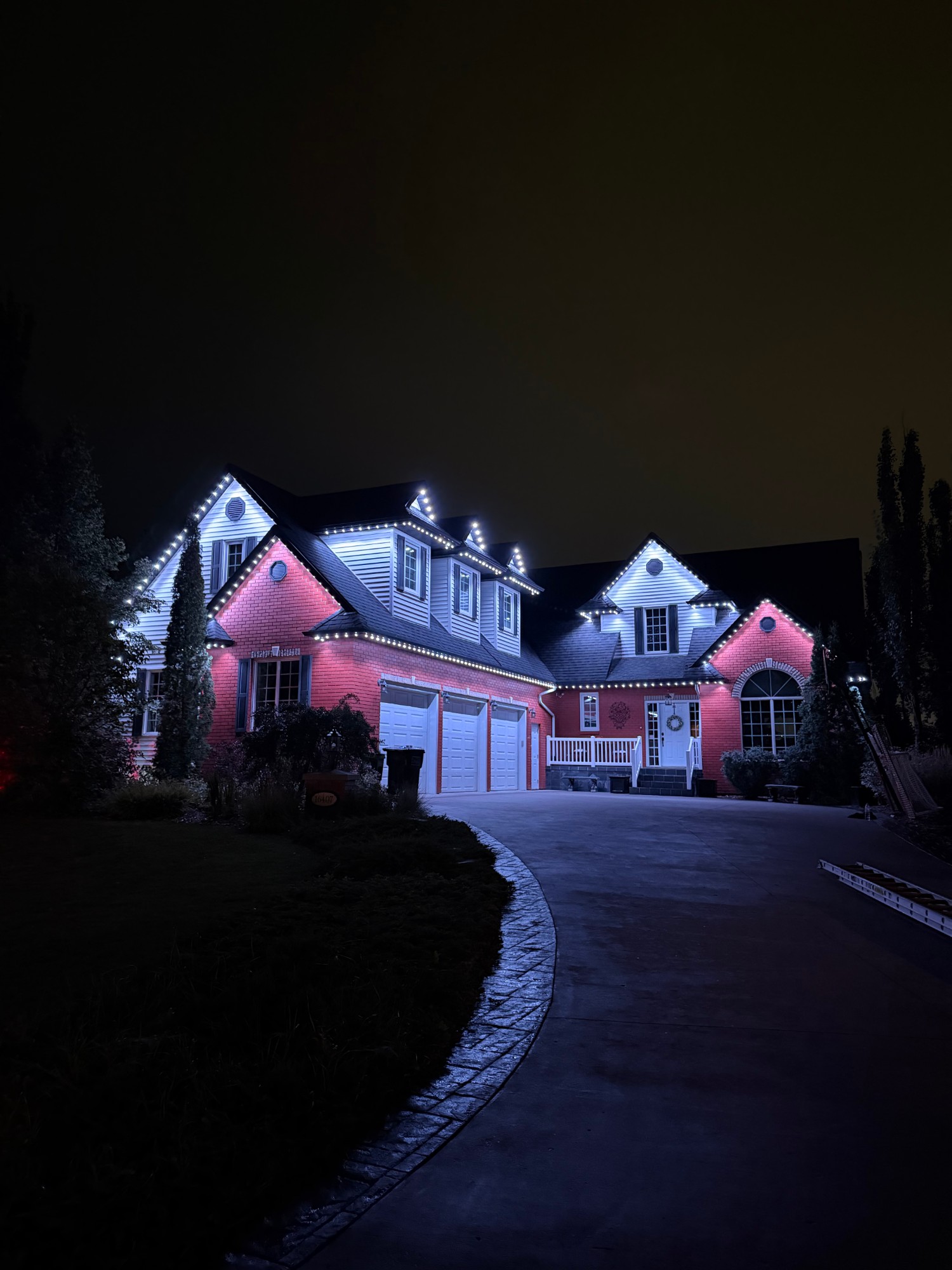 House with Aurum Lights permanent lighting turned on